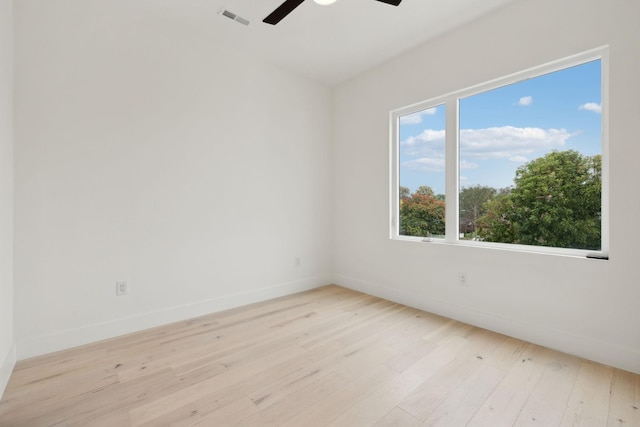 spare room featuring light wood-type flooring and ceiling fan