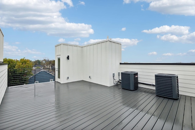 wooden deck featuring central air condition unit