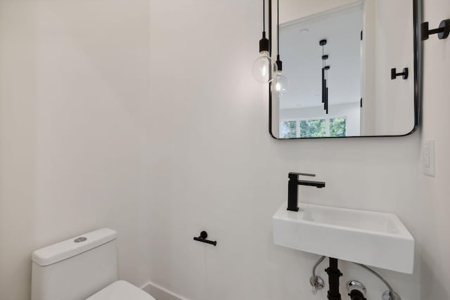 bathroom with toilet and sink