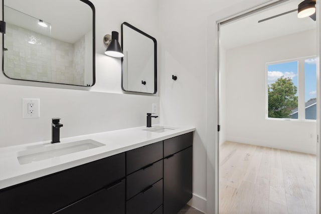 bathroom with vanity, hardwood / wood-style flooring, and walk in shower