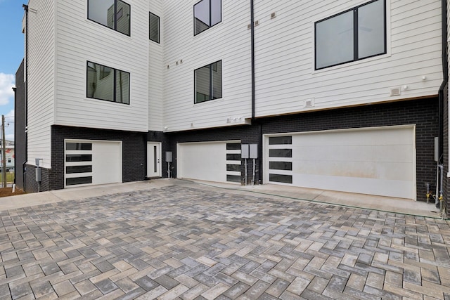 view of side of home with a garage