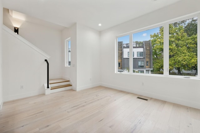 unfurnished living room featuring light hardwood / wood-style floors