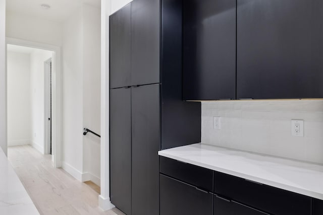 room details with tasteful backsplash and wood-type flooring