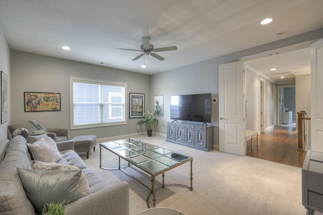 living room featuring ceiling fan and carpet floors