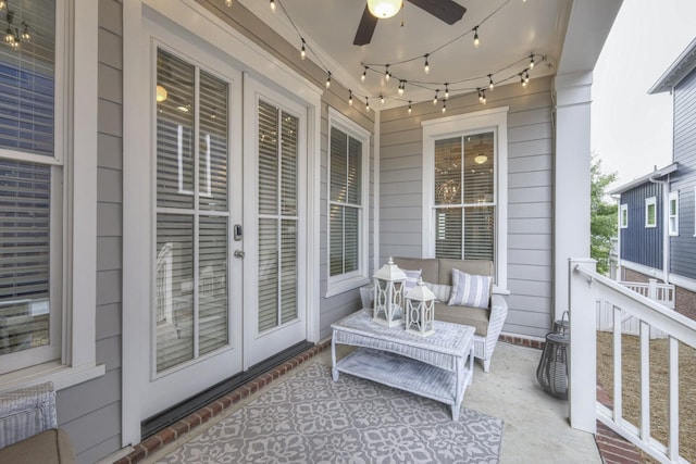 balcony with a porch, french doors, and ceiling fan