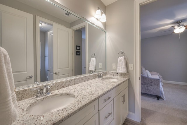 bathroom featuring vanity and ceiling fan