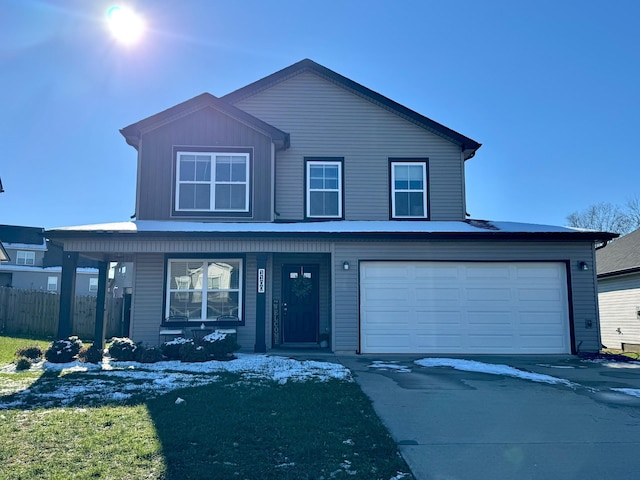 view of front of house with a porch and a garage