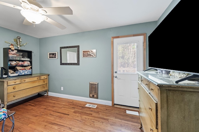 interior space with ceiling fan and light wood-type flooring