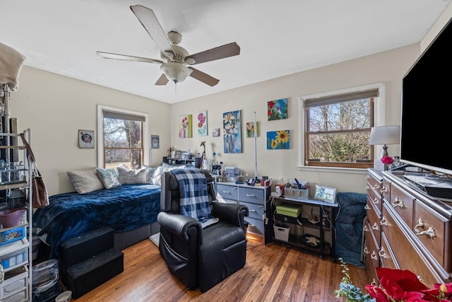 bedroom with ceiling fan and wood finished floors