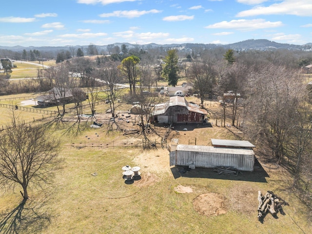 aerial view featuring a rural view and a mountain view