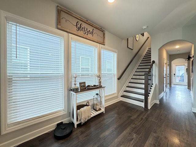 stairs with hardwood / wood-style flooring