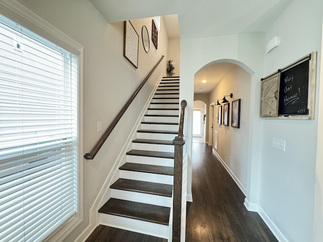 stairway featuring hardwood / wood-style flooring