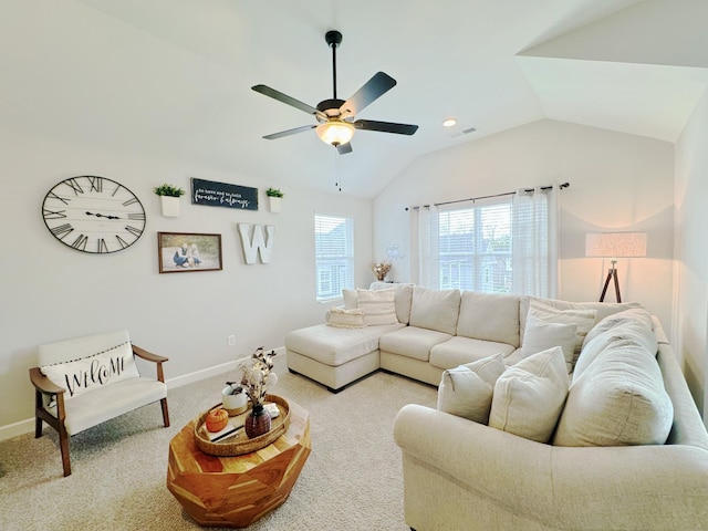 carpeted living room featuring ceiling fan and lofted ceiling