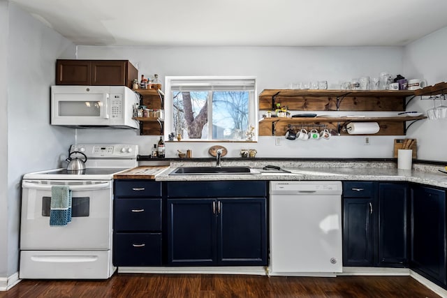 kitchen featuring blue cabinetry, dark hardwood / wood-style flooring, white appliances, and sink