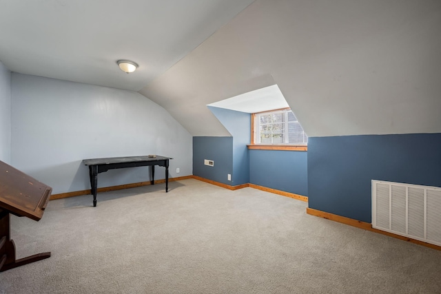 bonus room featuring carpet floors and lofted ceiling