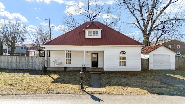 view of front of house with covered porch, an outdoor structure, and a garage