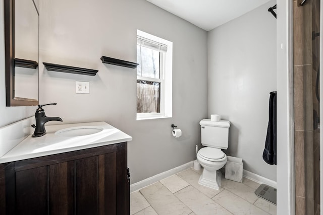 bathroom featuring tile patterned flooring, vanity, and toilet