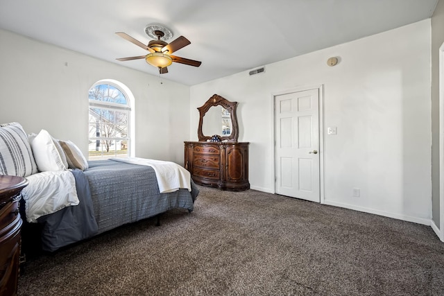 bedroom with dark colored carpet and ceiling fan