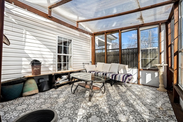 sunroom / solarium with vaulted ceiling