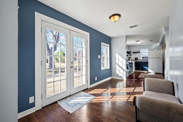 doorway featuring french doors and dark wood-type flooring