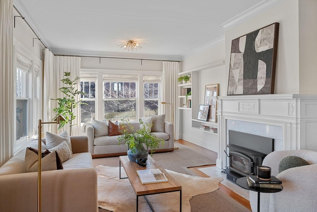 living room with crown molding and light hardwood / wood-style flooring