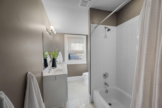 full bathroom featuring tile patterned floors, shower / bath combo with shower curtain, vanity, and toilet