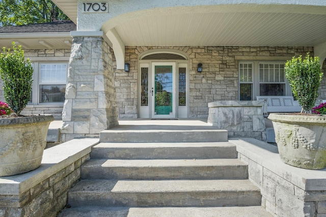 entrance to property with a porch