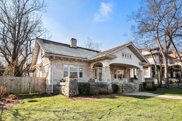 view of front of property featuring a front lawn and covered porch