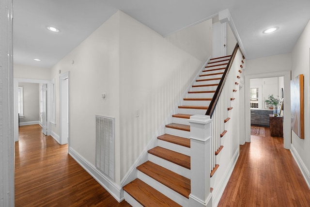 stairway with wood-type flooring