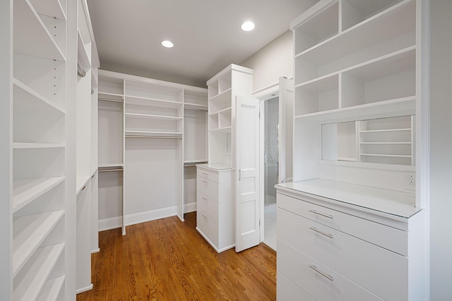 walk in closet featuring hardwood / wood-style floors