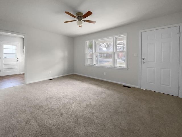 interior space with ceiling fan