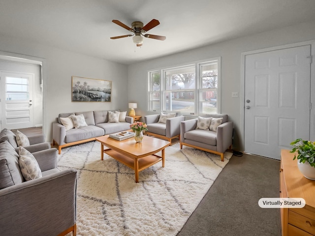 living room featuring carpet flooring and ceiling fan