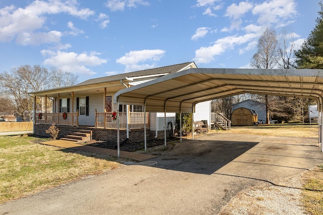 view of vehicle parking featuring a carport and a yard