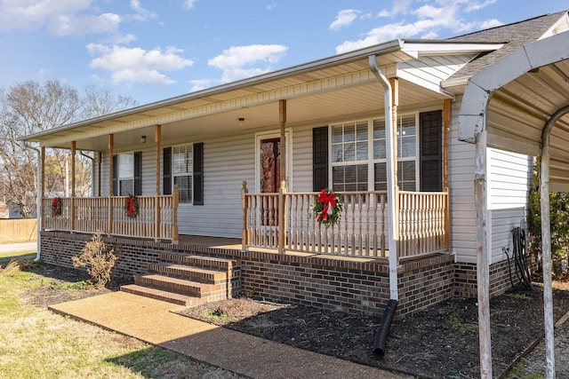 view of front of property featuring covered porch