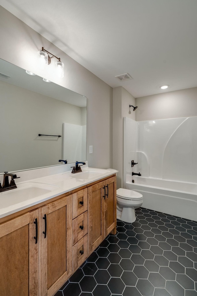 full bathroom featuring vanity, toilet, and shower / tub combination