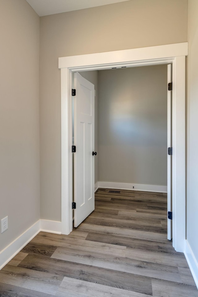 hallway with light wood-type flooring