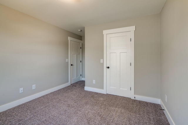 unfurnished bedroom with a closet and carpet floors