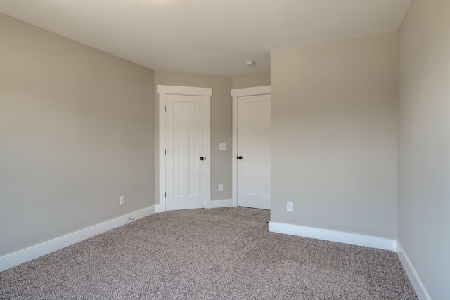 unfurnished room with carpet floors