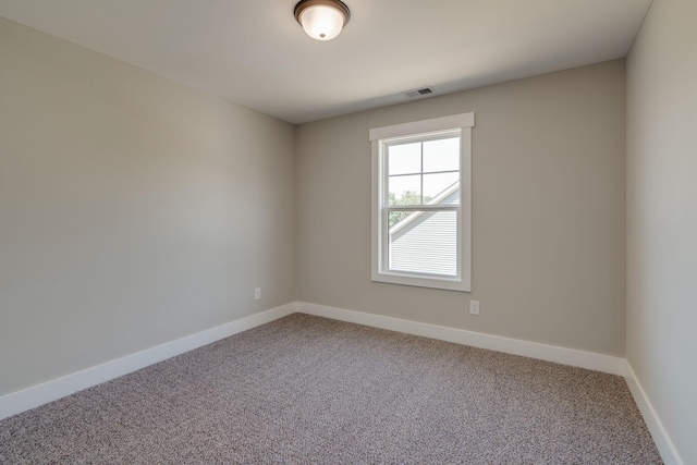 unfurnished room featuring carpet