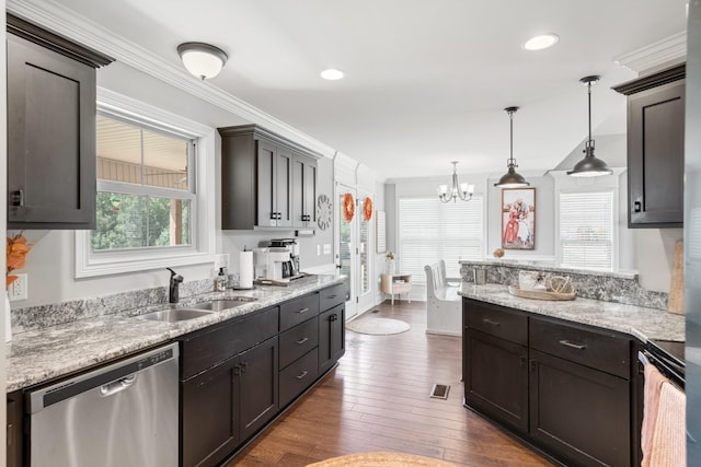 kitchen featuring dishwasher, dark wood-type flooring, sink, ornamental molding, and decorative light fixtures