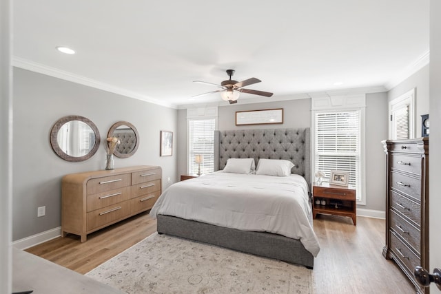 bedroom featuring ceiling fan, light wood-type flooring, and crown molding