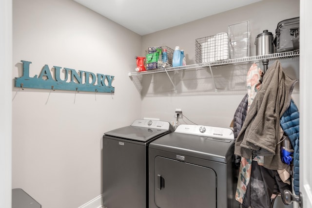 laundry room with washing machine and clothes dryer