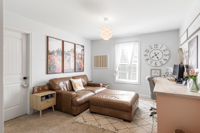 sitting room featuring light colored carpet