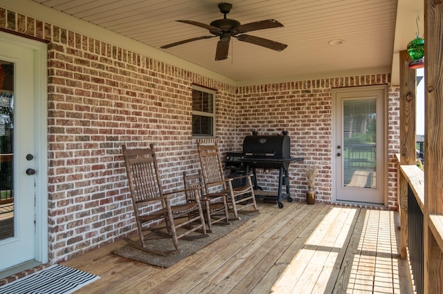 deck with ceiling fan and grilling area