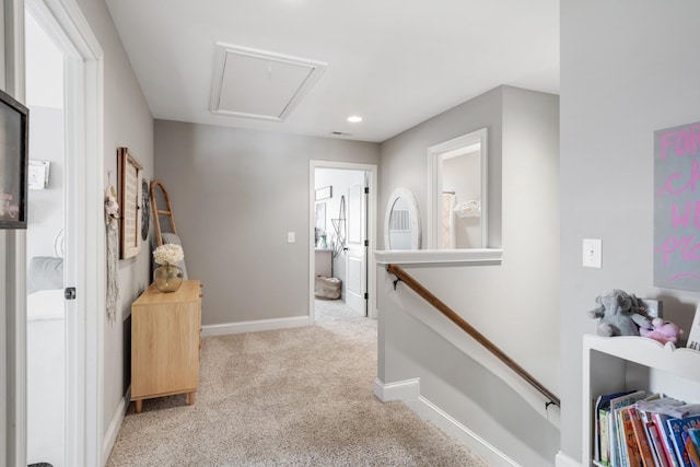 corridor with light colored carpet