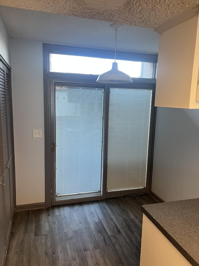 entryway with dark hardwood / wood-style floors