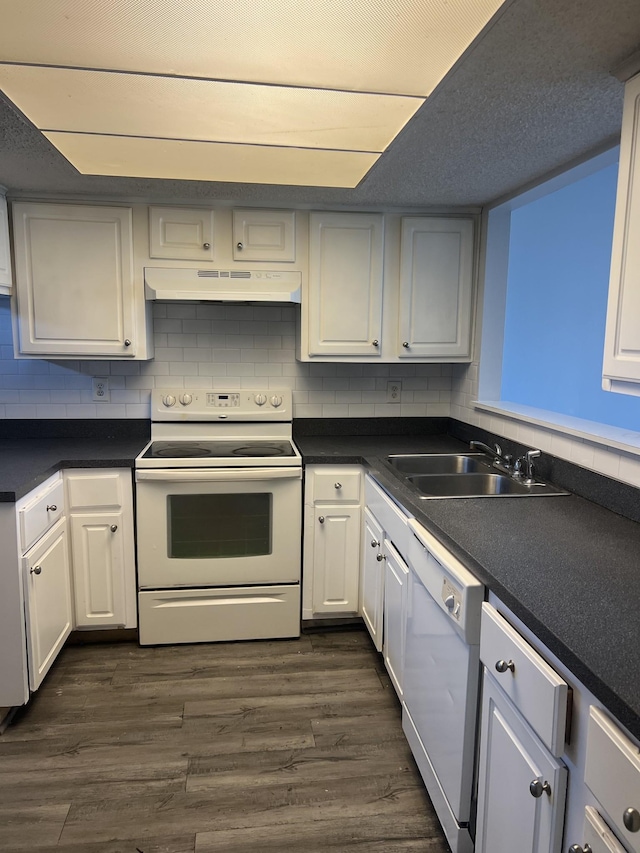 kitchen with white appliances, dark wood-type flooring, exhaust hood, sink, and white cabinetry