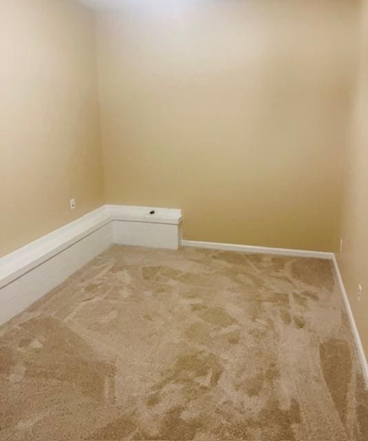 empty room with carpet flooring