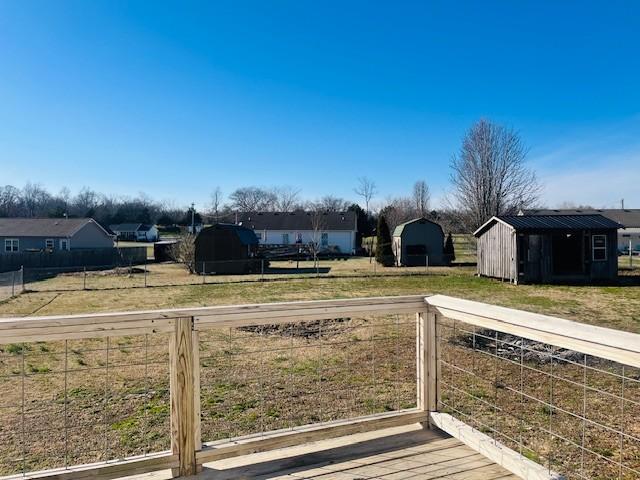 view of yard with a storage unit