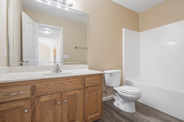 full bathroom with vanity, wood-type flooring, shower / tub combination, and toilet